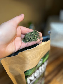 picture of a loose leaf herb in someone's hand